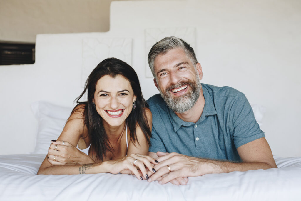 Couple spending their honeymoon in bed